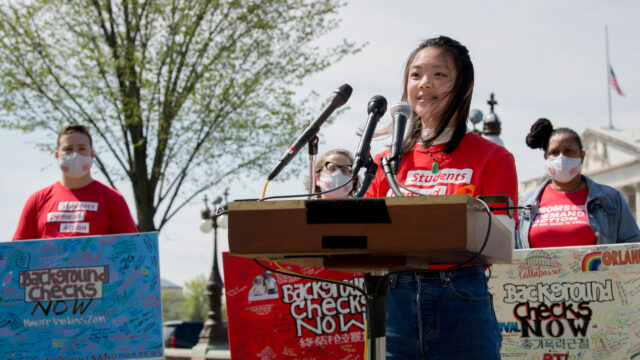 Jeannie She speaks at the podium at the Road Trip for Background Checks event at the Capitol