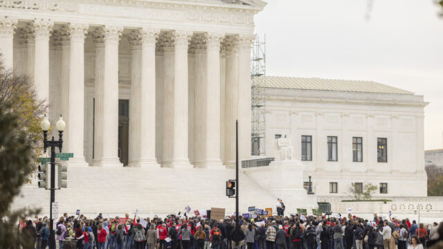 A large group of Moms Demand Action volunteers and other gun violence prevention advocates rally in front of the Supreme Court.