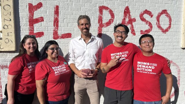 Moms Demand Action volunteers pose for a photo with Beto O'Rourke