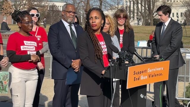Angela Ferrell-Zabala stands behind a podium on Capitol Hill