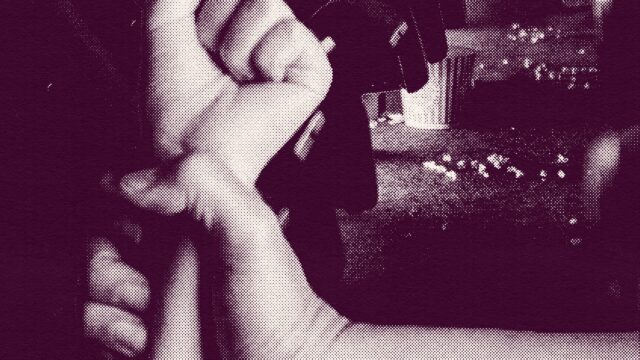 A magenta-hued textured graphic in which a person's hand grips another's wrist in a row of movie theater seats with a bucket of popcorn spilled in the background. The image represents one person's experience with teen dating violence.